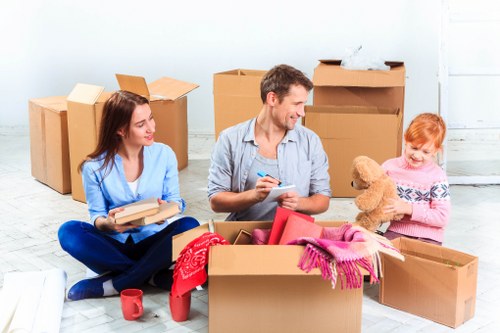 House moving team handling packed household items with care
