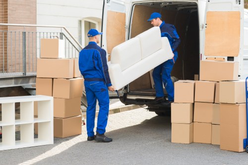Careful loading of large furniture items for transport in Croydon