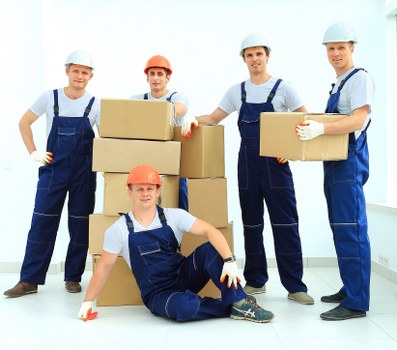 Loading household furniture into a removal truck in Croydon