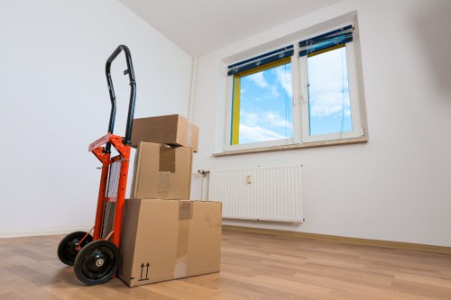 Packed moving boxes and furniture prepared for transport in Croydon